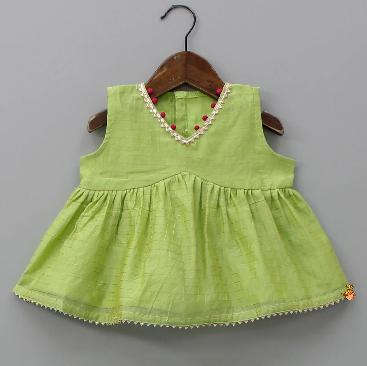 Pre Order: Contrasting Potli Buttons Detail Leaf Green Top And Gota Tassels Enhanced Lehenga
