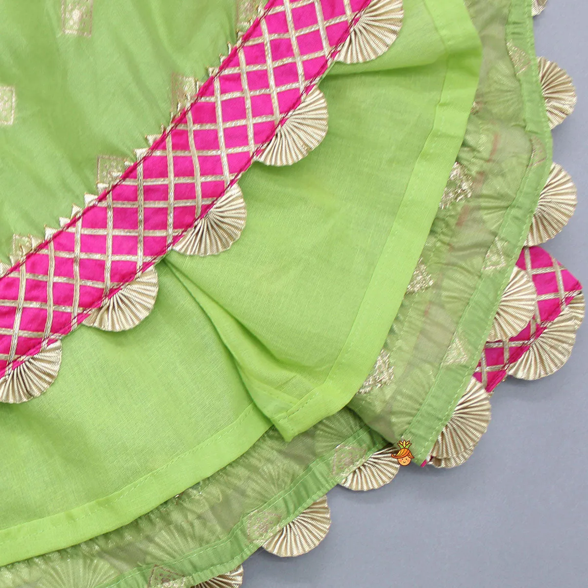 Pre Order: Contrasting Potli Buttons Detail Leaf Green Top And Gota Tassels Enhanced Lehenga